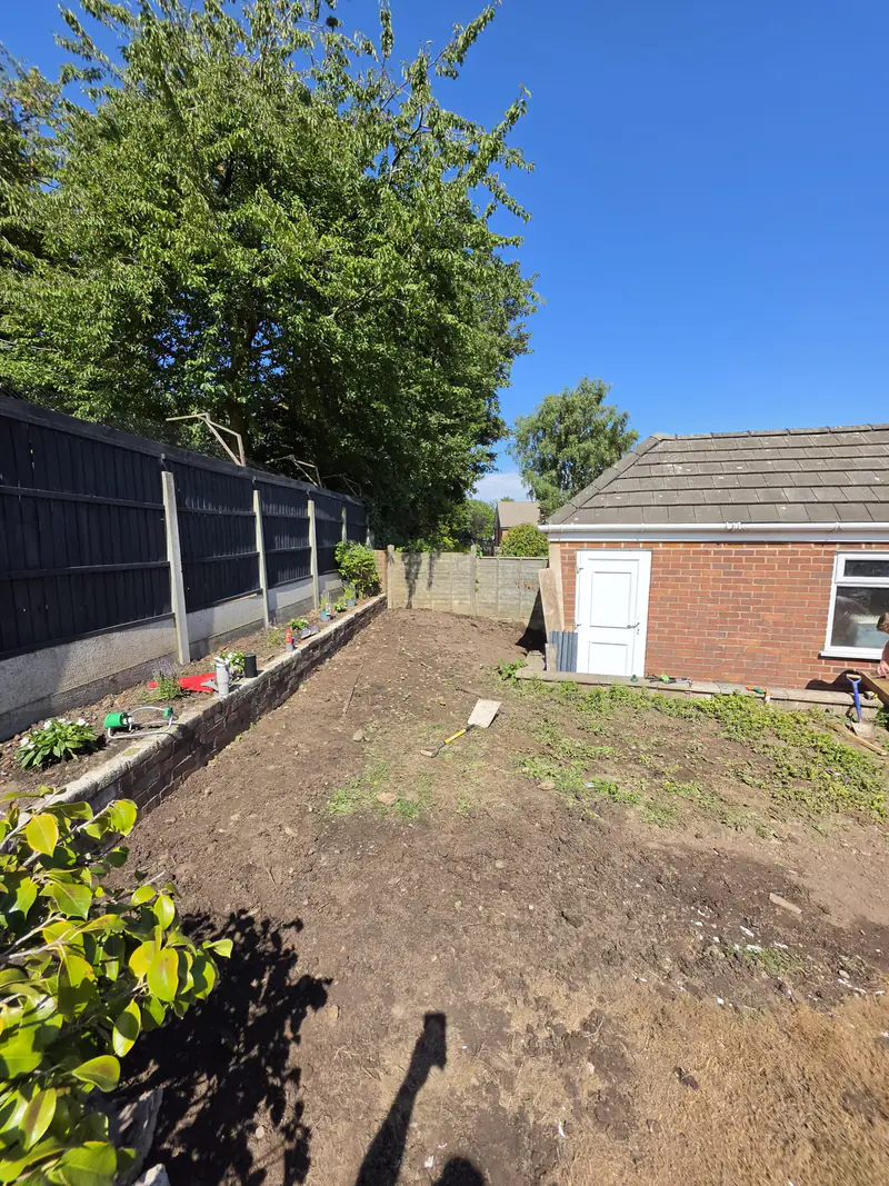 Overgrown Runcorn garden being cleared before a new lawn is laid
